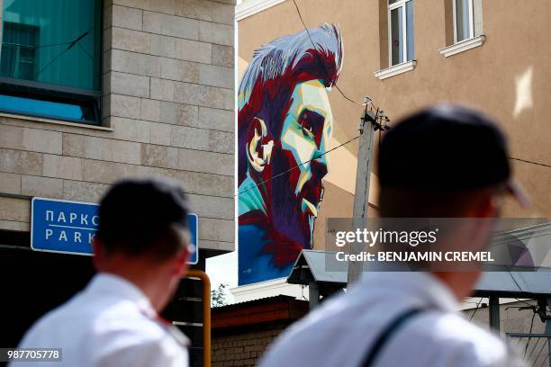 Mural signed by "Supernovanet" shows a portrait of Argentina's forward Lionel Messi on the wall of a building in Kazan on June 30, 2018 during the...