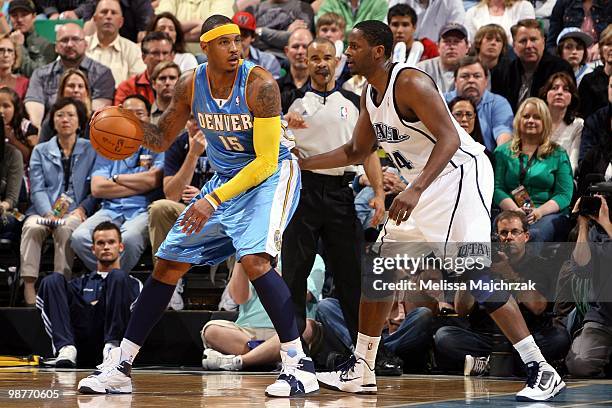 Carmelo Anthony of the Denver Nuggets looks to make a move against C.J. Miles of the Utah Jazz in Game Four of the Western Conference Quarterfinals...