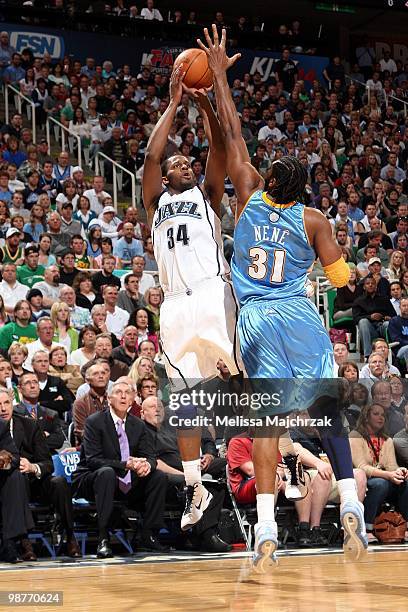 Miles of the Utah Jazz shoots a jump shot against Nene of the Denver Nuggets in Game Four of the Western Conference Quarterfinals during the 2010 NBA...