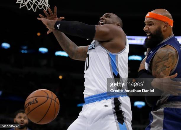 Drew Gooden of 3's Company swipes the ball away from Glen Davis of Power during week two of the BIG3 three on three basketball league at United...