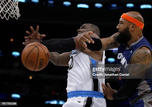 Drew Gooden of 3's Company swipes the ball away from Glen Davis of Power during week two of the BIG3 three on three basketball league at United...