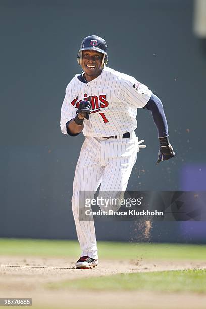 Orlando Hudson of the Minnesota Twins advances to third base against the Cleveland Indians on April 22, 2010 at Target Field in Minneapolis,...