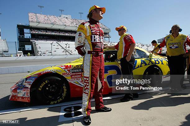 Clint Bowyer, driver of the Zaxby's Chevrolet, looks on during qualifying for the Nationwide Series BUBBA burger 250 at Richmond International...