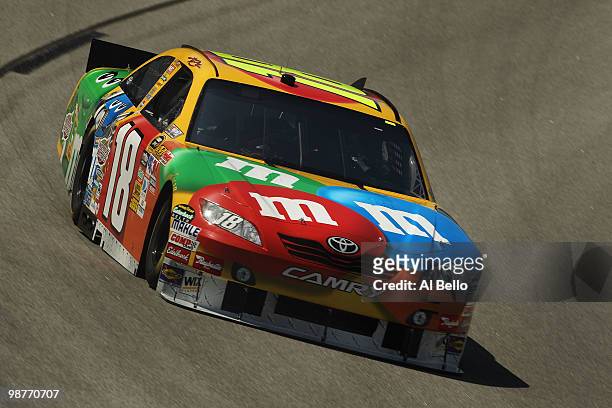 Kyle Busch, driver of the M&M's Toyota, drives during practice for the NASCAR Sprint Cup Series CROWN ROYAL Presents the Heath Calhoun 400 at...