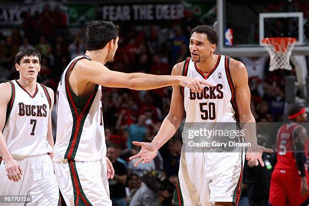 Carlos Delfino and Dan Gadzuric of the Milwaukee Bucks discuss a play in Game Three of the Eastern Conference Quarterfinals against the Atlanta Hawks...