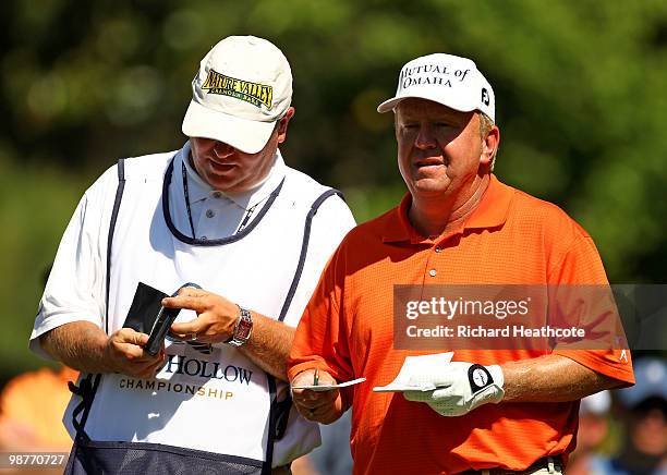 Billy Mayfair looks at his yardages with his caddy on the 6th tee during the second round of the Quail Hollow Championship at Quail Hollow Country...