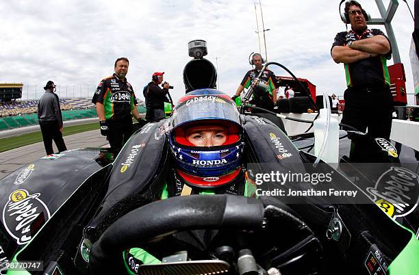 Danica Patrick sits in her Go Daddy.com Andretti Autosport Honda Dallara during practice for the Indy Car Series Road Runner Turbo Indy 300 on April...