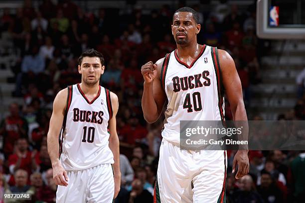 Kurt Thomas and Carlos Delfino of the Milwaukee Bucks celebrate a play against the Atlanta Hawks in Game Three of the Eastern Conference...