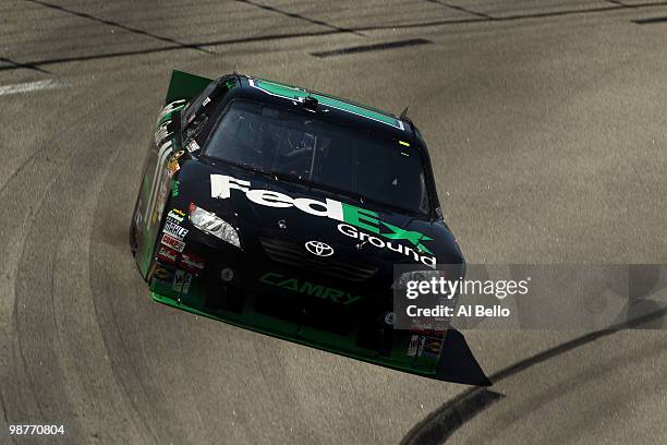 Denny Hamlin, driver of the FedEx Ground Toyota, drives during practice for the NASCAR Sprint Cup Series CROWN ROYALO Presents the Heath Calhoun 400...