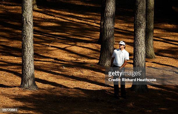 Bubba Watson plays from the trees on the 3rd hole during the second round of the Quail Hollow Championship at Quail Hollow Country Club on April 30,...
