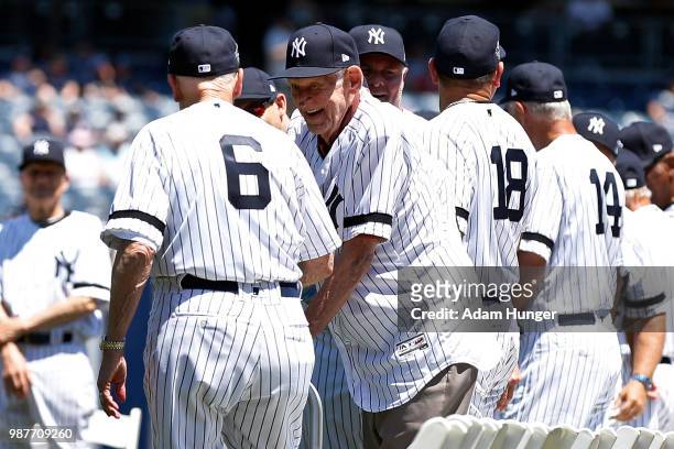 Former players Dr. Bobby Brown and Don Larsen of the New York Yankees are introduced during the New York Yankees 72nd Old Timers Day game before the...