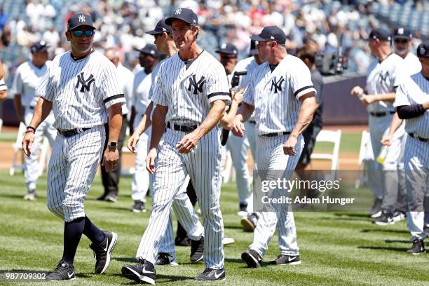 Former players Dr. Bobby Brown and Reggie Jackson of the New York Yankees take a selfie during the New York Yankees 72nd Old Timers Day game before...