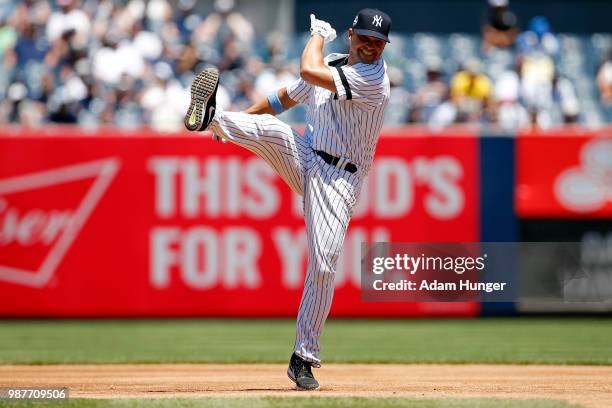 Former player Nick Swisher of the New York Yankees in action during the New York Yankees 72nd Old Timers Day game before the Yankees play against the...