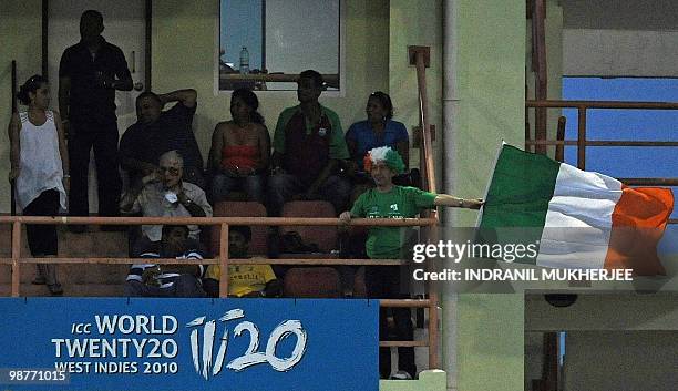 Lone Irish supporter waves the flag as George Dockrell of Ireland bowls to Ramnaresh Sarwan of West Indies cricketer during their ICC World Twenty20...