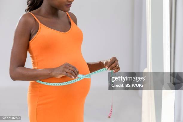 8 months pregnant woman. - bsip stockfoto's en -beelden