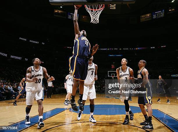 Roy Hibbert of the Indiana Pacers goes up for the slam dunk against the Washington Wizards during the game at the Verizon Center on April 14, 2010 in...