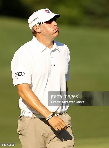 Ricky Barnes reacts on the 15th green during the second round of the Quail Hollow Championship at Quail Hollow Country Club on April 30, 2010 in...