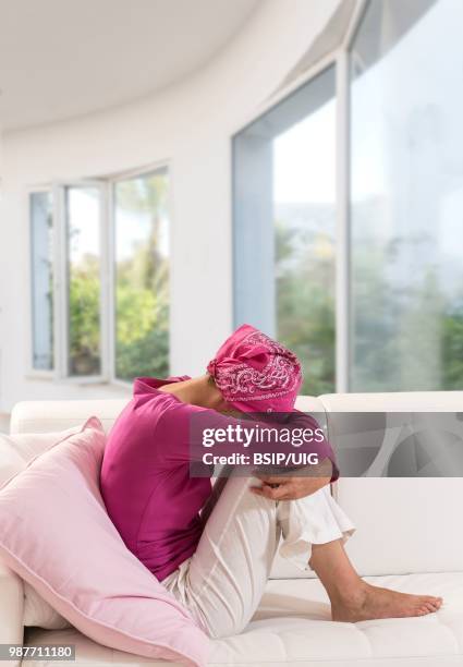 sad woman wearing a headscarf. - bsip stockfoto's en -beelden