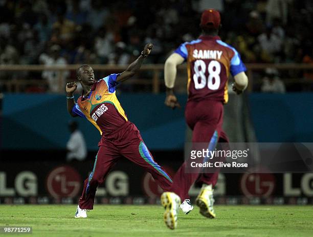 Kemar Roach of West Indies celebrates with Darren Samy after taking the wicket of William Porterfield of Ireland during the ICC T20 World Cup Group D...