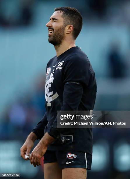 Kade Simpson of the Blues looks on as the final siren sounds for his 300th match during the 2018 AFL round15 match between the Carlton Blues and the...