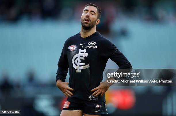 Kade Simpson of the Blues reacts as the final siren sounds for his 300th match during the 2018 AFL round15 match between the Carlton Blues and the...