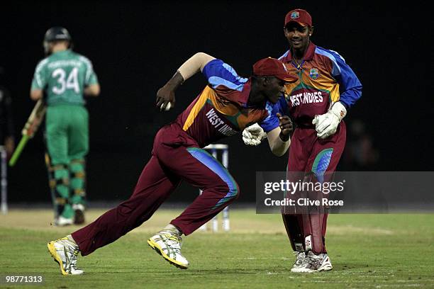 Darren Sammy of West Indies races to celebrate after catching William Porterfield of Ireland at slip during the ICC T20 World Cup Group D match...