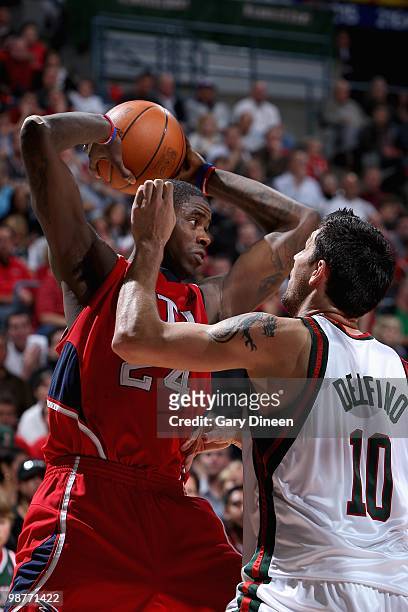 Marvin Williams of the Atlanta Hawks looks to pass over Carlos Delfino of the Milwaukee Bucks in Game Three of the Eastern Conference Quarterfinals...
