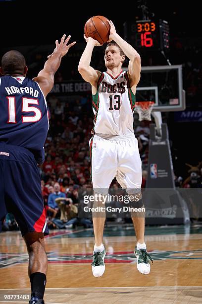 Luke Ridnour of the Milwaukee Bucks shoots against the Atlanta Hawks in Game Four of the Eastern Conference Quarterfinals of the 2010 NBA Playoffs on...