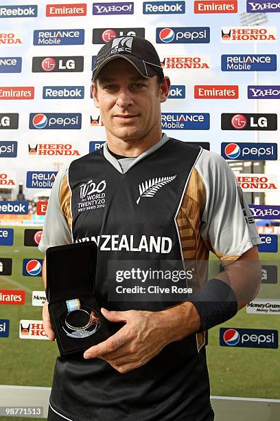 Nathan McCullum of New Zealand poses with his man of the match trophy after the ICC T20 World Cup Group B match between Sri Lanka and New Zealand at...
