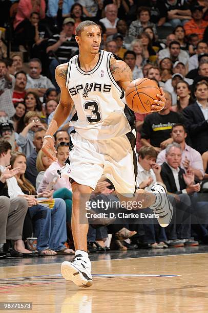 George Hill of the San Antonio Spurs drives the ball upcourt against the Dallas Mavericks in Game Six of the Western Conference Quarterfinals during...