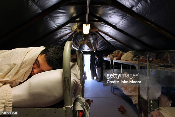 Undocumented immigrants sleep in their tent at the Maricopa County Tent City Jail on April 30, 2010 in Phoenix, Arizona. Some 200 undocumented...