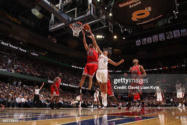 Joakim Noah of the Chicago Bulls pulls down a rebound against Anderson Varejao of the Cleveland Cavaliers in Game Five of the Eastern Conference...