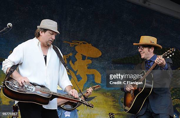 Musicians Jerry Douglas and Elvis Costello perform during Day 4 of the 41st Annual New Orleans Jazz & Heritage Festival at the Fair Grounds Race...