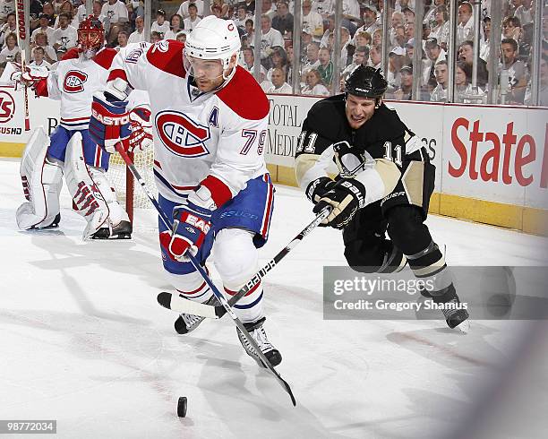 Andrei Markov of the Montreal Canadiens moves the puck in front of the defense of Jordan Staal of the Pittsburgh Penguins in Game One of the Eastern...