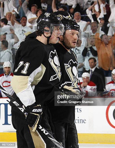Sergei Gonchar of the Pittsburgh Penguins celebrates his goal with Evgeni Malkin against the Montreal Canadiens in Game One of the Eastern Conference...