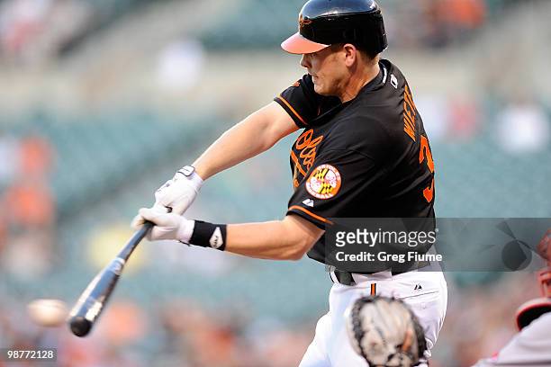 Matt Wieters of the Baltimore Orioles hits a single in the first inning against the Boston Red Sox at Camden Yards on April 30, 2010 in Baltimore,...