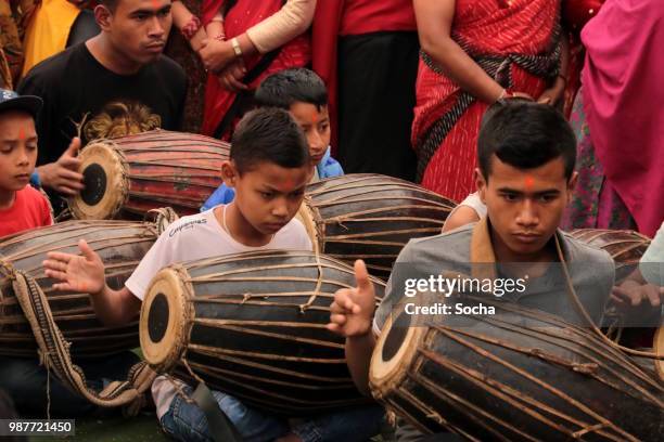 young people playing on leather drums (tabla)  in nepal - tabla stock pictures, royalty-free photos & images