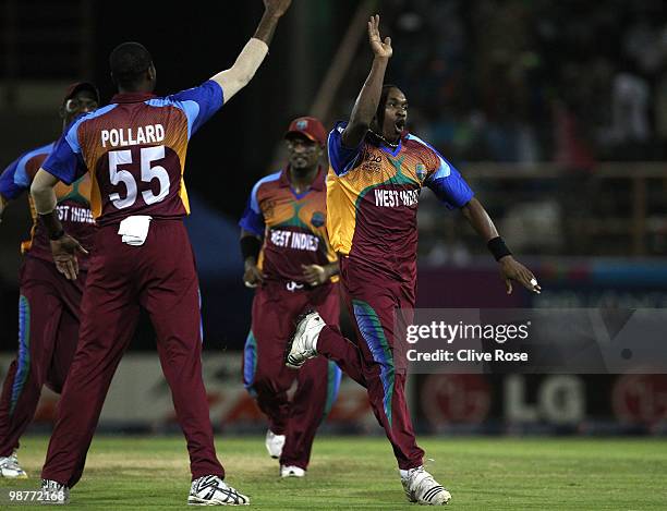 Dwayne Bravo of West Indies celebrates the wicket of Trent Johnston of Ireland during the ICC T20 World Cup Group D match between West Indies and...