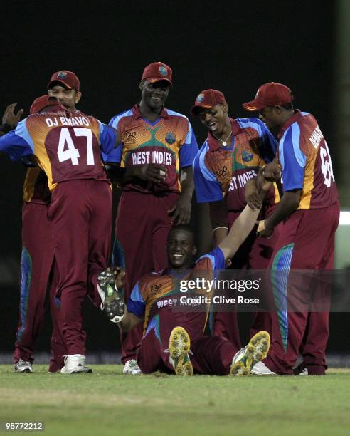 Darren Sammy of West Indies is congratulated on his match winning performance after taking the final wicket during the ICC T20 World Cup Group D...