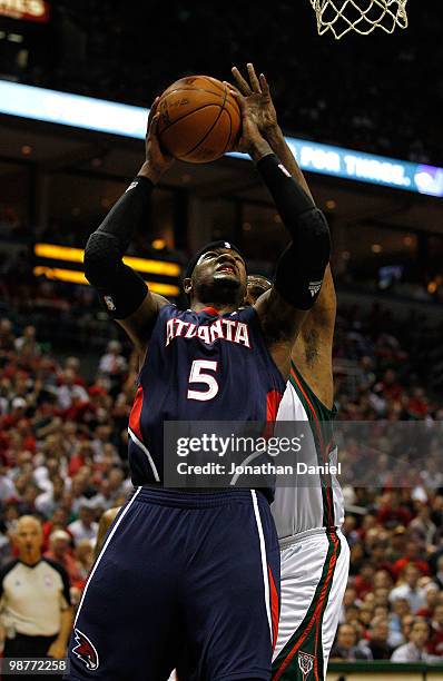 Josh Smith of the Atlanta Hawks puts up a shot over Kurt Thomas of the Milwaukee Bucks in Game Six of the Eastern Conference Quarterfinals during the...