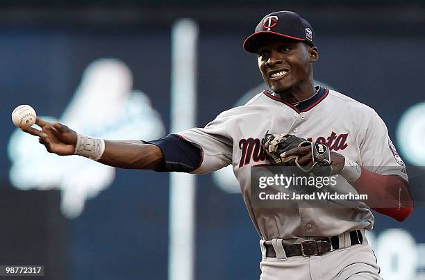 Orlando Hudson of the Minnesota Twins throws to first base during the game against the Cleveland Indians on April 30, 2010 at Progressive Field in...