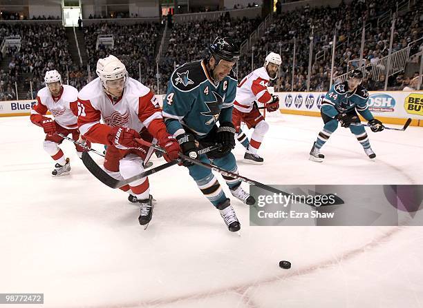 Rob Blake of the San Jose Sharks and Valtteri Filppula of the Detroit Red Wings go for the puck in Game One of the Western Conference Semifinals...