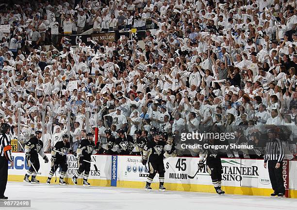 Craig Adams of the Pittsburgh Penguins celebrates his goal with the bench against the Montreal Canadiens in Game One of the Eastern Conference...