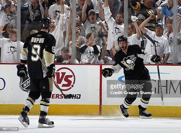 Craig Adams of the Pittsburgh Penguins celebrates his goal with Pascal Dupuis against the Montreal Canadiens in Game One of the Eastern Conference...