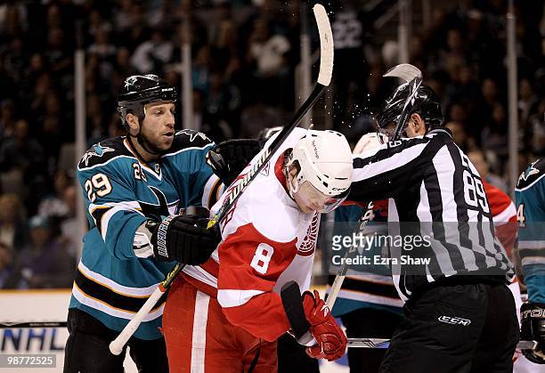 Ryane Clowe of the San Jose Sharks pushes Justin Abdelkader of the Detroit Red Wings in Game One of the Western Conference Semifinals during the 2010...
