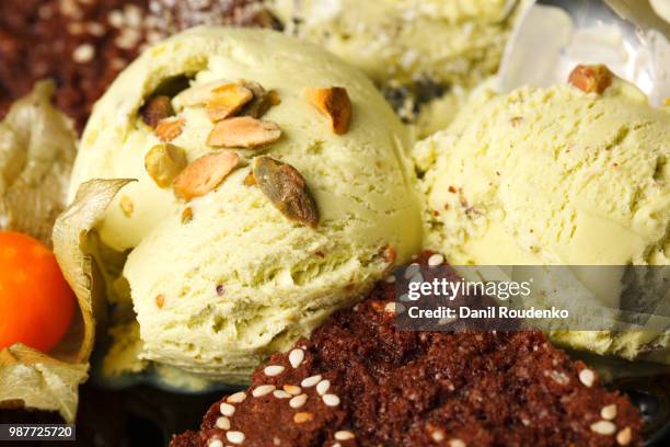 pistachio ice cream topped with nuts - pistachio ice cream stock pictures, royalty-free photos & images