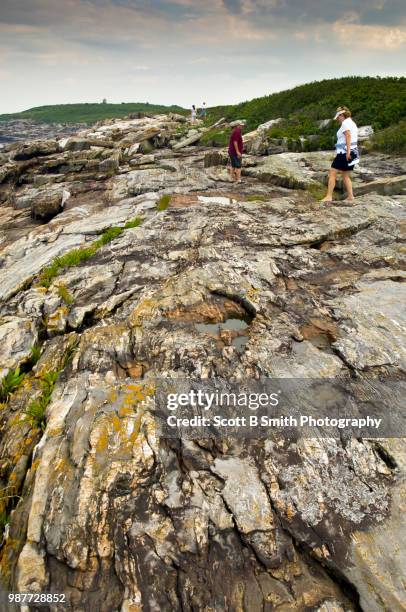 hiking along the rocky east shore of damariscove island preserve maine - smith island stock pictures, royalty-free photos & images