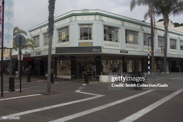Shopping district on an overcast day in downtown Napiers, New Zealand, with retail stores visibible, November 29, 2017.