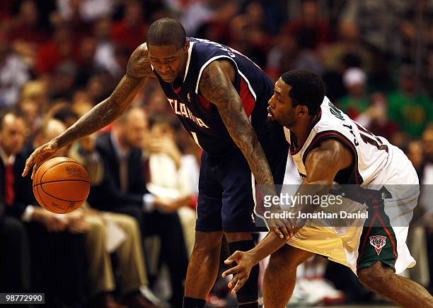 Jamal Crawford of the Atlanta Hawks holds off John Salmons of the Milwaukee Bucks in Game Six of the Eastern Conference Quarterfinals during the 2010...