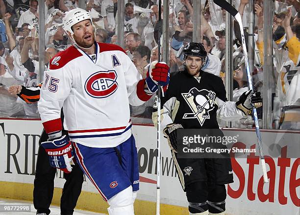 Alex Goligoski of the Pittsburgh Penguins celebrates his goal in front of Hal Gill of the Montreal Canadiens in Game One of the Eastern Conference...